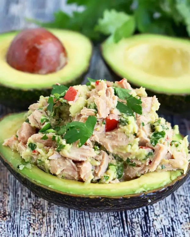 Tuna-Stuffed Avocado Delight is a quick, healthy meal.